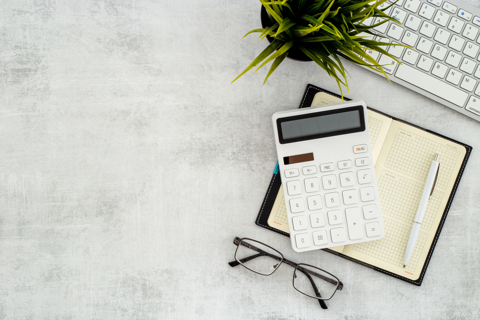 Financial accounting analisis with calculator on office table, top view